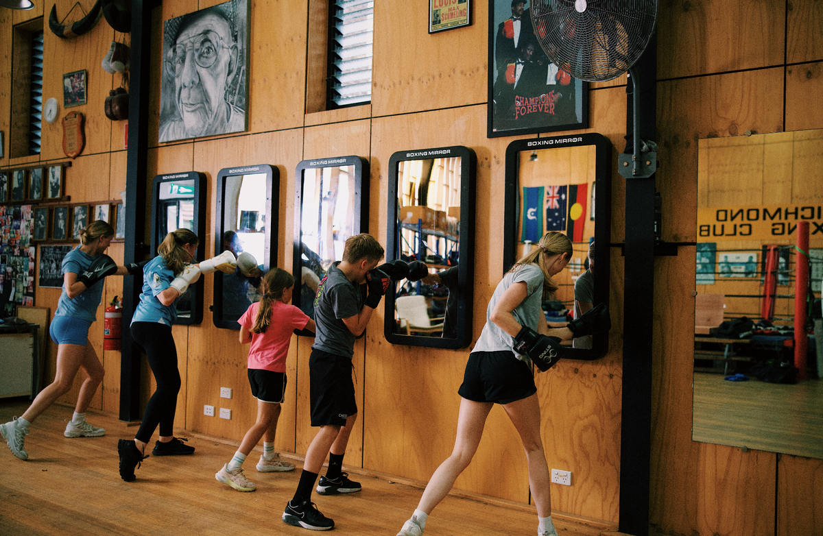 Combat Mirror in use at a boxing gym.