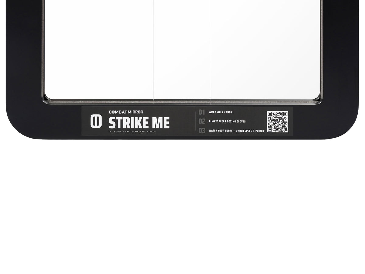 Close-up of the Strike Me sticker applied to a Combat Mirror.
